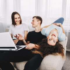 friendship, technology, happiness, leisure, social media, fun concept. Excited friends having fun...