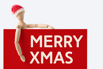 wooden santa claus mannequin hold empty red board