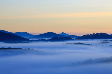 Misty mountain layer at dawn