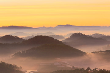 Misty mountain layer at dawn