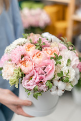 floral bunch in head box. European floral shop. Bouquet of beautiful Mixed flowers in woman hand. Excellent garden flowers in the arrangement , the work of a professional florist.