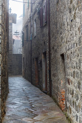 Dark mysterious narrow alley