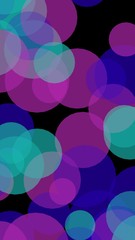 Multicolored translucent circles on a dark background. Vertical image orientation. 3D illustration