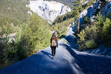 sporty hiking woman walking along a trail in Switzerland near Rheinschlucht