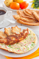 Breakfast with crab stick omelette, toast and coffee, selective focus