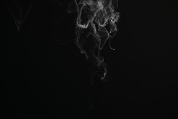 closeup abstract stream of vapor over black background