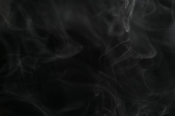 closeup abstract vapor over black background for backdrop or overlay