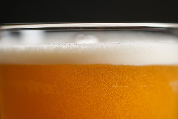 Closeup pouring beer in glass