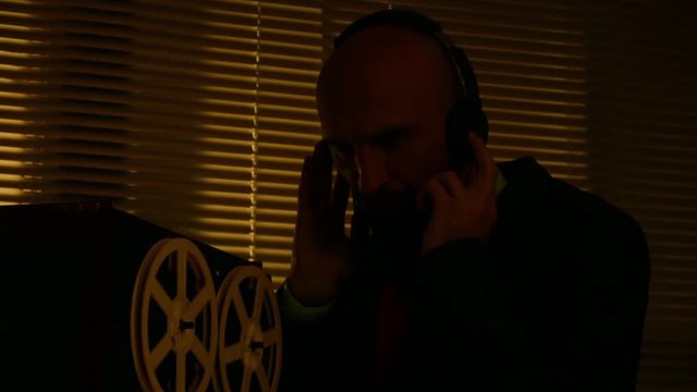 Special agent scout listens to conversations and makes a record on the tape6