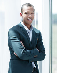 closeup portrait of confident young businessman on a light background
