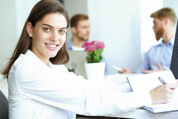 business woman with her staff, people group in background at modern bright office indoors.