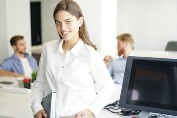 Fototapeta premium business woman with her staff, people group in background at modern bright office indoors.