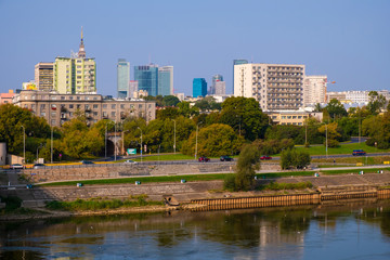 Obraz na płótnie Canvas Warsaw, Poland - Panoramic view of the Warsaw city center and Powisle district by the Vistula river bank