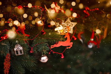 christmas tree decorated with balls ,lights and toys /toned/close up