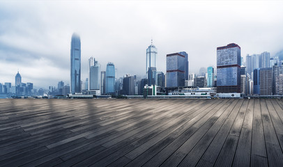Panoramic skyline and modern buildings with empty boardwalk in Hong Kong