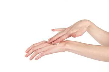 Elegant female hands smear hand cream. Skin care.
