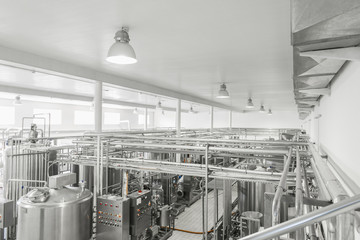 general view of the interior of a milk factory. equipment at the dairy plant