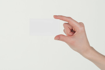 hand holding blank card isolated with clipping path
