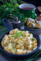 fresh potatoes cooked in sour cream, selective focus