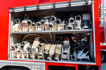 Rescue fire truck equipment. Compartment of the rolled up fire hoses on a fire engine
