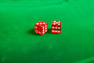 playing cards,dices and poker chips on green poker table