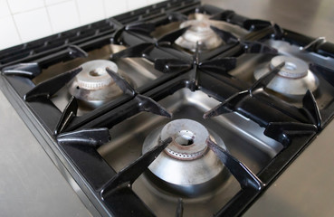 Close Up On A Burner Of Four On A Gas Stove