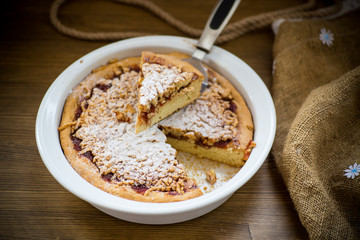sweet cake with jam in ceramic form