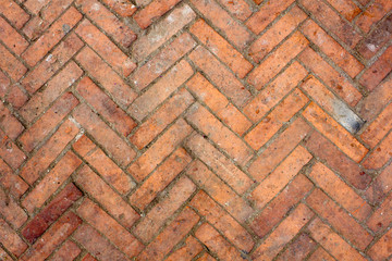 old dirty red brick parquet. rough surface texture. parquet with stains of paint and dirt
