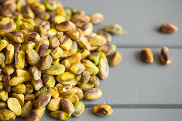 Pistachios nuts on grey background