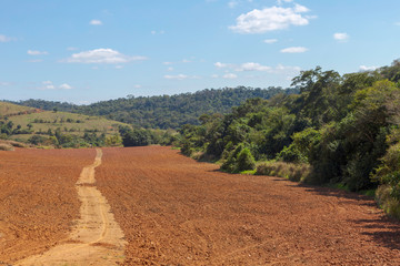 Fototapeta na wymiar Terra arada para plantio de milho em propriedade rural de Guarani, estado de Minas Gerais, Brasil