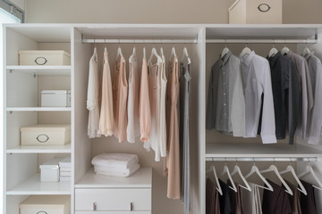 modern closet with clothes hanging