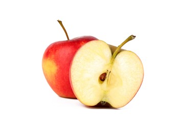 Red ripe apple with a half fresh sliced apple isolated on white