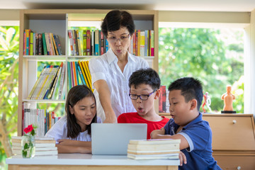 asia school kids technology and communication with laptop