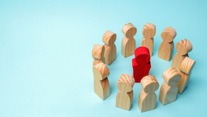 A crowd of workers stand in a circle and listen to their mentor, leader or CEO.The concept of...