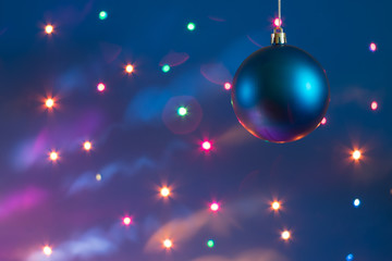  Blue Christmas ball on a festive background with bokeh effect for New Year's greetings