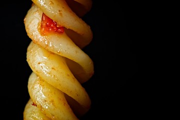 Fototapeta na wymiar Fusilli Pasta spiral with a tomato sauce