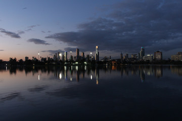 Modern city skyline behind lake