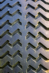 old tractor with rubber tires in green countryside yard in green summer