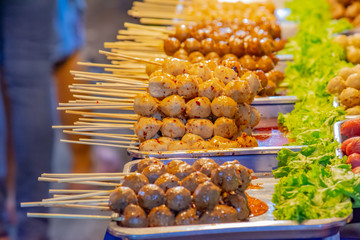 Grilled pork meatballs and meatballs On the tray with water spicy pussy.
