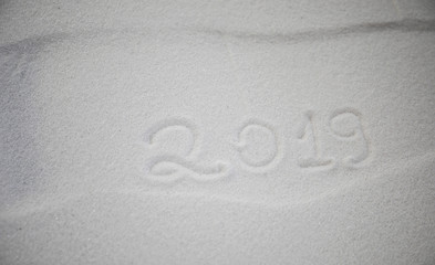Fototapeta na wymiar 2019 written on the snow. Happy new 2019 year. Empty space for your text
