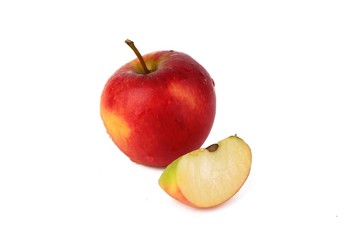 Red ripe apple with fresh sliced apple piece isolated on white
