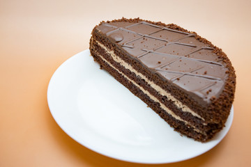Delicious chocolate cake on a light background