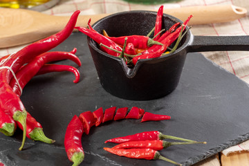 red chili peppers on a slate