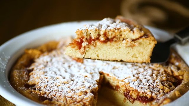 sweet cake with jam in ceramic form