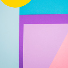 Texture background of fashion blue, yellow and purple papers in memphis geometry style. Flat lay, 90s concept  .