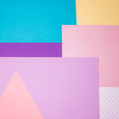 Texture background of fashion blue, yellow and purple papers in memphis geometry style. Flat lay, Top view.  .