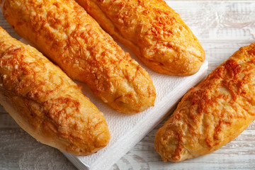 cheese buns, bread with cheese on a white wooden background