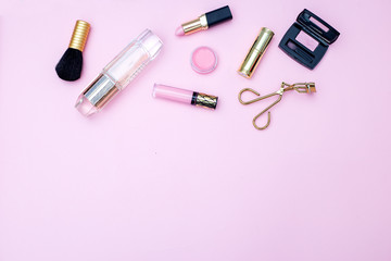 Women's accessories on pink background. Copy space