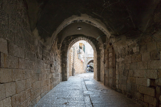 The quiet streets of Jerusalem. The tunnel under the houses on Maronites Monastery street in old city of Jerusalem, Israel