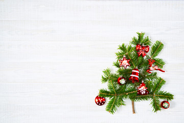 Fototapeta na wymiar Festive composition of Christmas decorations on white wooden background.
